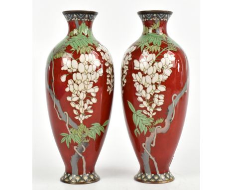 A pair of Japanese cloisonné vases, decorated with wisteria against a white ground, height 21cm.Additional InformationOne wit