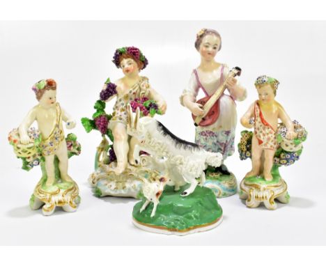 DERBY; two 18th century hard paste porcelain figures, the first representing a seated maiden wearing a band of grapes and vin