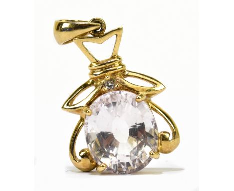 A yellow metal and morganite diamond pendant, the large oval four claw set morganite beneath a tiny round brilliant cut diamo