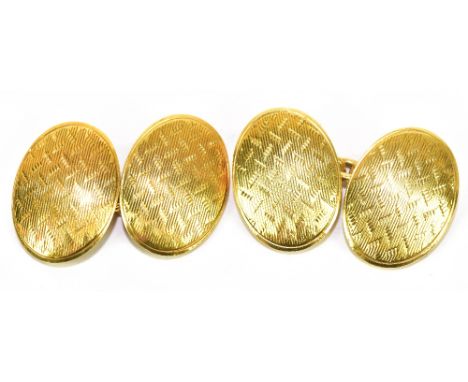 A pair of 18ct yellow gold cufflinks each with engine turned detail to the oval platform, approx 13.9g.