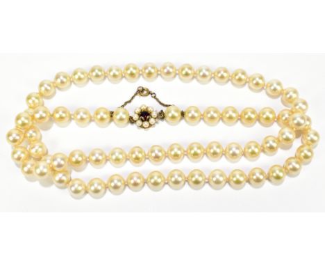 A full strand of simulated pearls set with yellow metal clasp, length 77cm.Additional InformationPlease note these are simula