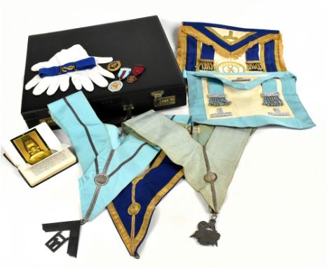 MASONIC INTEREST; a briefcase containing Masonic regalia, including a gilt applied Cheshire apron, hallmarked silver jewel, f