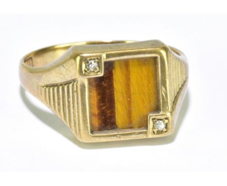 A 9ct yellow gold tiger's eye set signet ring with tiny opposing twin diamonds to the square platform, size U 1/2, approx 4.8