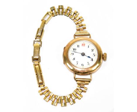 A 9ct yellow gold lady's vintage wristwatch with Arabic numerals to the white enamel dial, diameter excluding winding crown 2