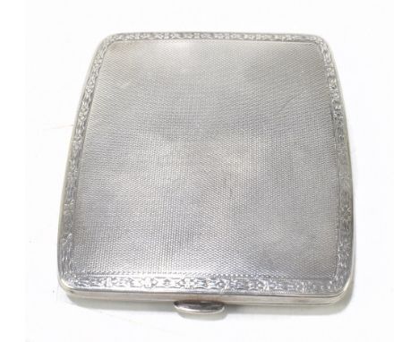 GOLDSMITHS & SILVERSMITHS; a George V hallmarked silver mounted cigarette case with engine turned detailing, London 1913, gro
