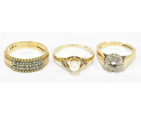 A 9ct yellow gold dress ring set with a central pearl flanked by two melee diamonds, approx size O, together with two further