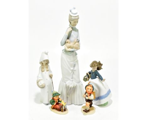 LLADRO; two figures including a lady clutching her dog, height 36cm, together with a Nao figure of a girl holding a basket an