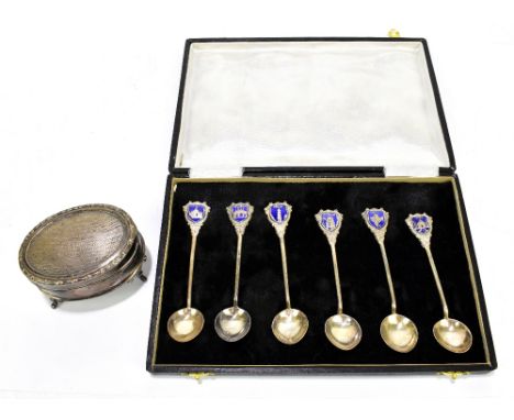 An Edwardian hallmarked silver oval trinket box, Birmingham 1913, length 7cm, with a cased set of six sterling silver and ena