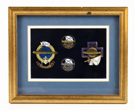 A framed set of four USSR submariners' badges relating to the Oscar II class nuclear submarine K-141 'Kursk', framed as one, 