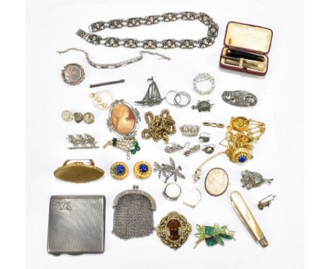 A group of costume jewellery including a floral decorated Arts &amp; Crafts style necklace, a white metal bracelet, silver co