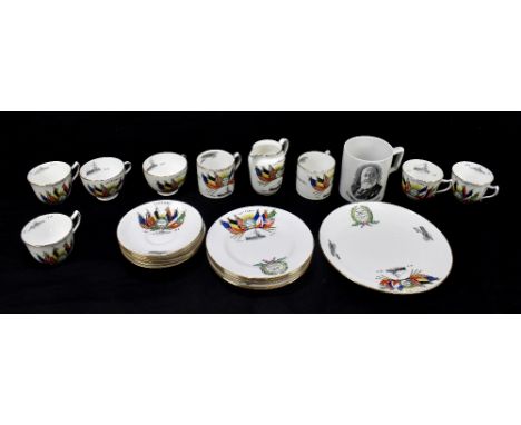 A WWI Armistice commemorative twenty-two piece part tea set, each piece decorated with the flags of victory, and with a wreat