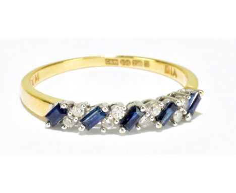 An 18ct yellow gold diamond and sapphire baguette and round brilliant cut ring, size R, approx 2.6g.