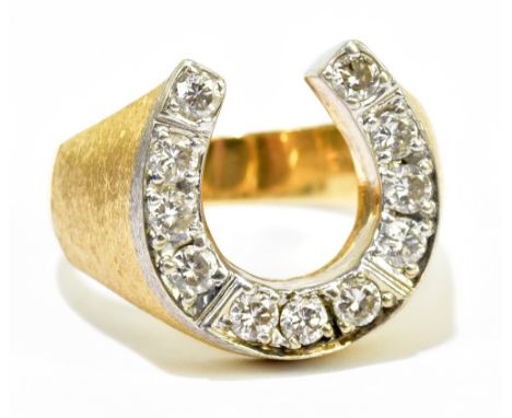 A 14ct gold and diamond set horse shoe gentleman's ring set with eleven round brilliant cut diamonds totalling approx 1ct and