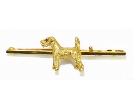 A 9ct yellow gold dog brooch with ruby for the eye, length 50mm, approx 5.6g.Additional InformationThe dog length is 20mm.&nb