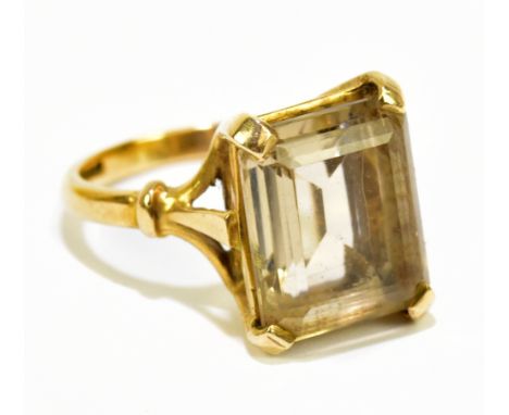 A 9ct yellow gold dress ring set with an emerald cut smoky quartz stone, approx size N 1/2, approx weight 5.9g.Additional Inf