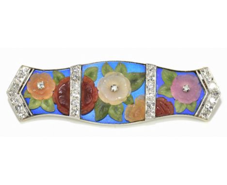 A good Art Deco white metal enamel diamond set and carved hardstone brooch, decorated with floral sprays within bands and end