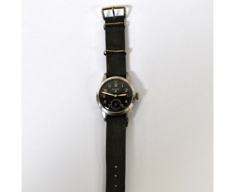 RECORD;  a chrome plated manual wind military issue wristwatch, with fifteen jewel movement, black circular dial with luminou