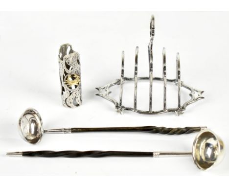 An Edwardian hallmarked silver toast rack, Birmingham 1905, with a modern silver scent bottle sleeve modelled with the star s