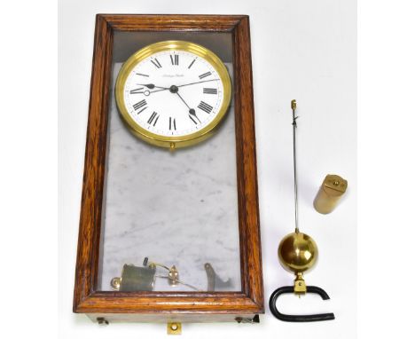 BRILLIE; an early 20th century oak cased electric wall clock, the enamel dial set with Roman numerals and signed Electrique B