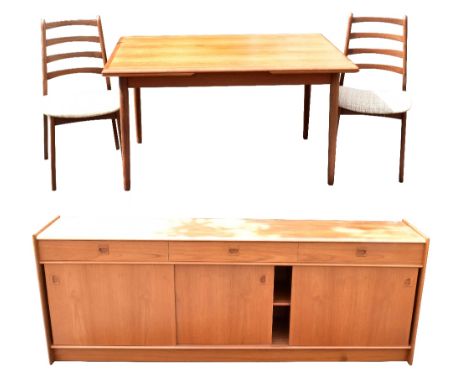 A mid-century Danish teak dining suite comprising draw-leaf dining table on turned column supports, length when extended 134c