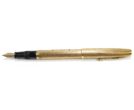 WATERMAN; a 9ct gold cased fountain pen with engine turned decoration, with 14K nib, approx weight 25.2g.Additional Informati