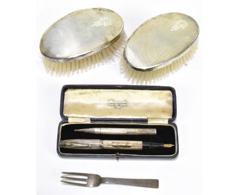 A group of small silver including a pen and pencil, a fork and spoon with plannished deocration, and a pair of brushes, vario