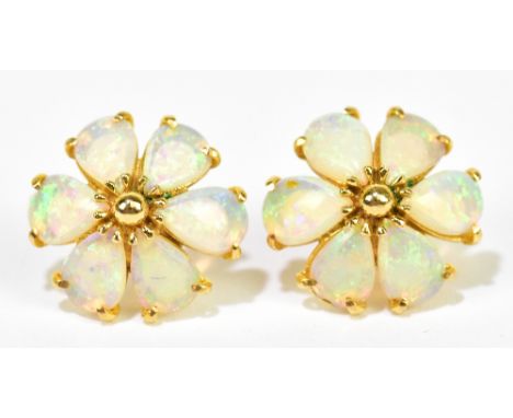 A pair of 14ct yellow gold and opal ear studs, each set with six pear shaped opal cabochons modelled as a flower head, diamet