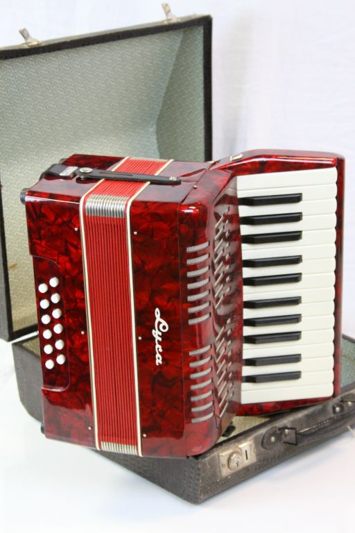 Cased vintage Accordion, German made with Red shell effect finish and