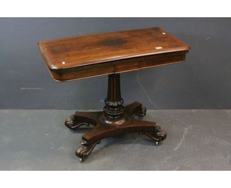 William IV Rosewood Card Table, the fold over top opening to reveal a circular pink baize playing surface, raised in fluted t