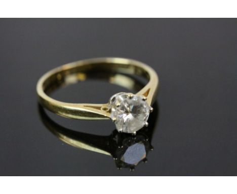 A diamond solitaire 18ct yellow gold ring, the round brilliant cut eight claw set diamond weighing stated weight 0.50 carat, 