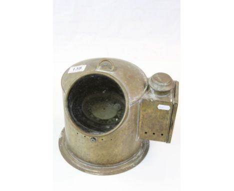 Vintage Ship's Compass in Brass cover case with glass porthole to front, stands approx 23cm, not counting the hanging loop