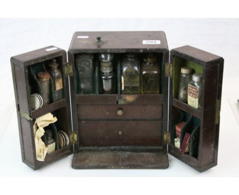 Victorian apothecary cabinet to include glass bottles, some with contents, cardboard boxes, tools, glass slides etc