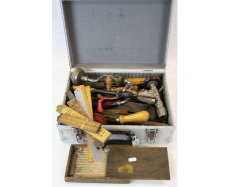 Aluminium case of vintage Tools to include folding rulers, hand drills, levels etc