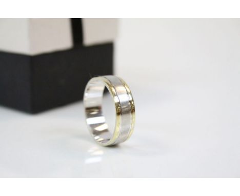 Gold plated and silver ring, central silver band with gold plated bands either side, band width approximately 6mm, ring size 