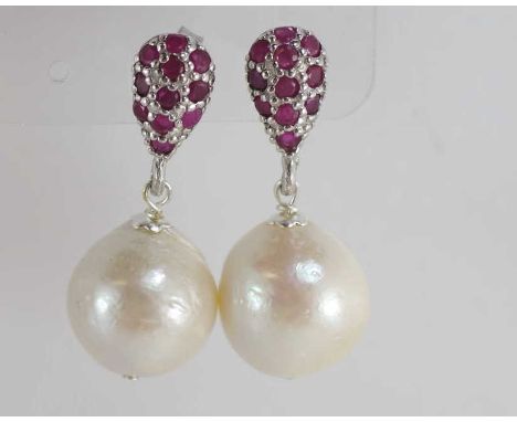 A pair of silver, pearl and ruby drop earrings