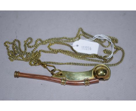 Boxed English brass Boatswain's whistle on brass chain, with original box and leaflet from Nauticalia, London.