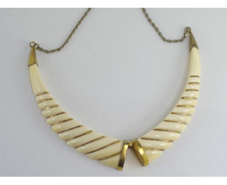 A vintage ivory and gold twist necklace NB This item may not be exported without CITES documentation.