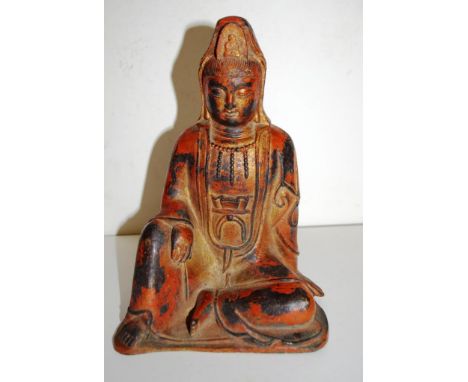 Vintage Eastern Buddha figure with remnants of red painted enamel. Height 24cm approx.