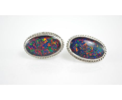 A pair of large white gold and opal earrings set with opals, marked 18ct but test as 14ct, with screw backs, total weight app