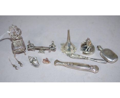 Collection nine various silver miniature pieces including cushioned chair, perfume bottle, seated cat teacher, conch shell, f
