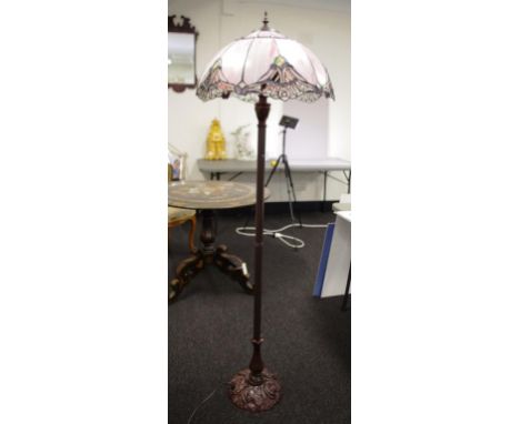 Tiffany style bronzed standard lamp with segmented pink and metal shade, on decorated base. Height 160cm approx (total).