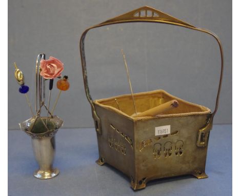 Vintage art nouveau brass pierced basket with sewing implements included, together with a silver plate basket pin cushion and