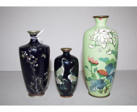 Three various Japanese cloisonne vases including 2 with decoration on black ground, and 1 floral decorated, on green ground (