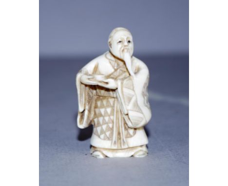 Vintage Japanese carved ivory okimono figure standing sage figure, signed to base. Export of this item is not permitted. Heig