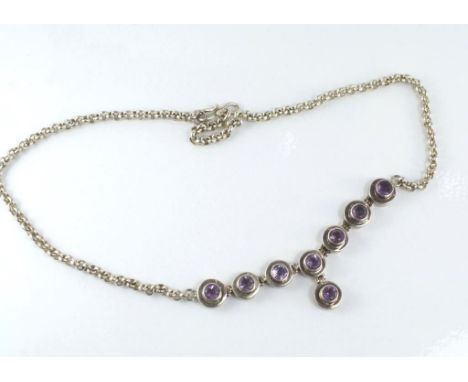 A silver and amethyst necklace