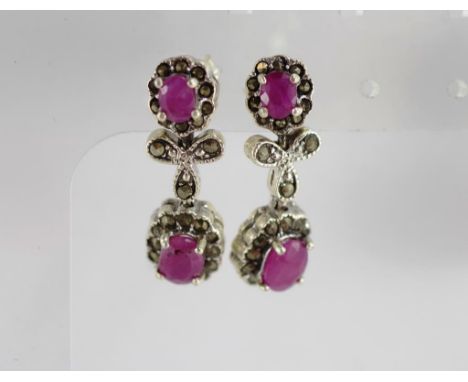 A pair of silver, marcasite and ruby drop earrings