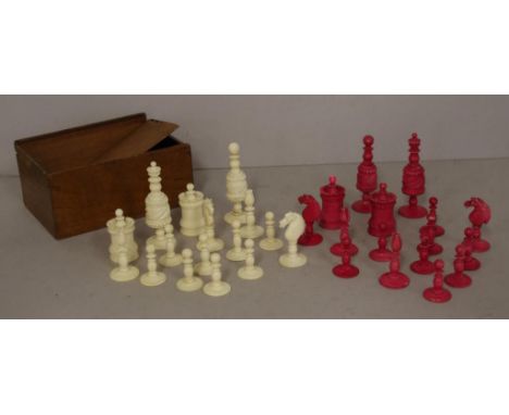 Antique carved ivory chess set including 16 white pieces and 16 red dyed pieces. With early lidded  wooden box. NB, This item