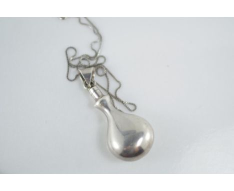 A Mexican Taxco silver perfume bottle pendant (does not open) on silver box chain