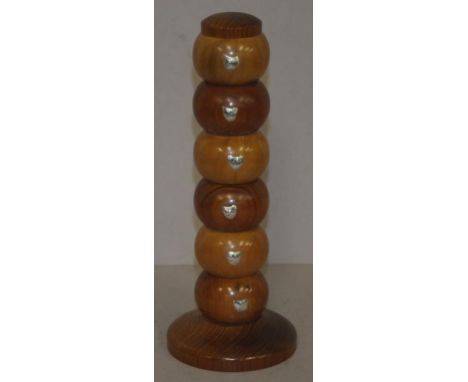 Set six Tasmanian timber napkin rings each marked with a silver map of Tasmania, on a wooden stand. Height 26cm approx (total