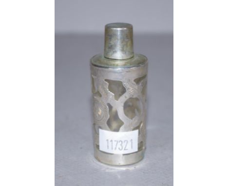 Eastern silver cased  miniature perfume bottle pierced silver casing, over glass bottle, marks to base. Height 6.5cm approx.